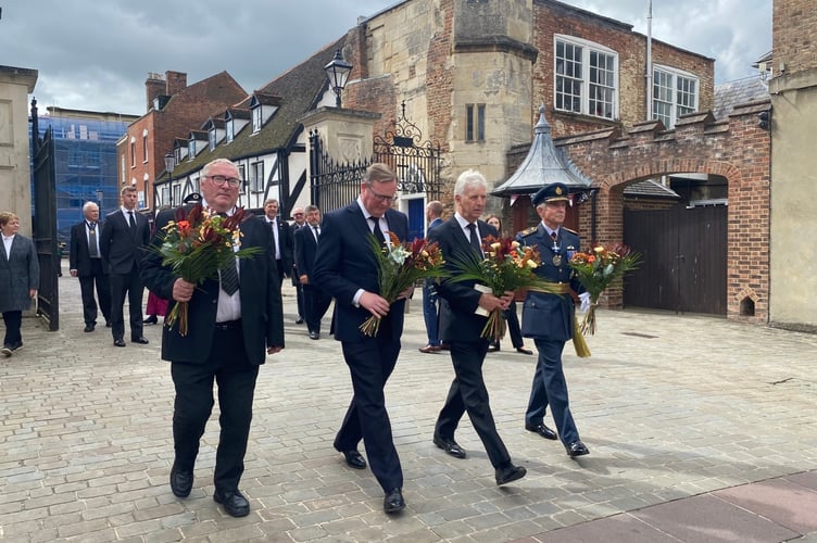 Cllr Alan Preest laying flowers