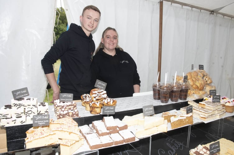 Josh and Katie Reynolds with their cakes