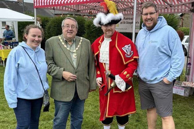 Chris Witham (right) with his wife Rachel, Mayor of Cinderford Cllr Roger Sterry and Cinderford town crier Jer Holland