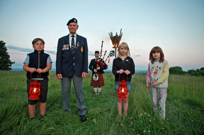 Les Meadows,who lit the beacon at Blaisdon with children from Hopebrook and Huntley primary schools.