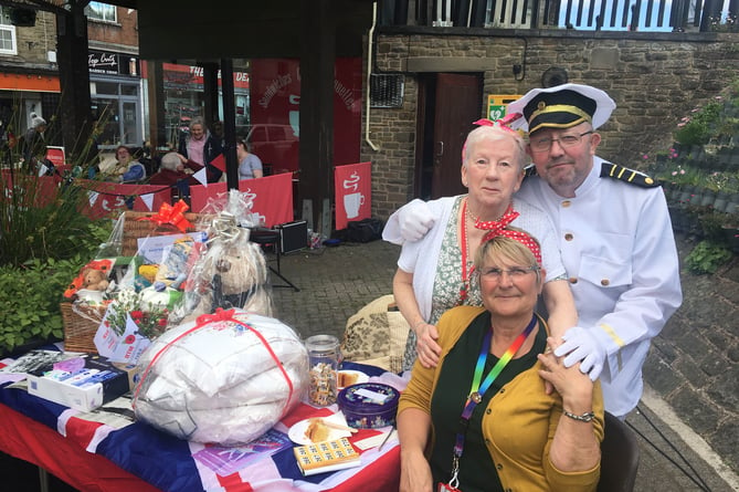 Volunteers from Crossroads Care with the raffle stall at the Cinderford tea party.