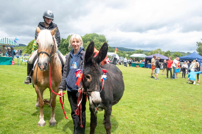 Ella Whitmarsh and Elizbeth Miller of SevernWye Equestrian. Ella is seated on Summer and Elizabethis with donkey Alice.