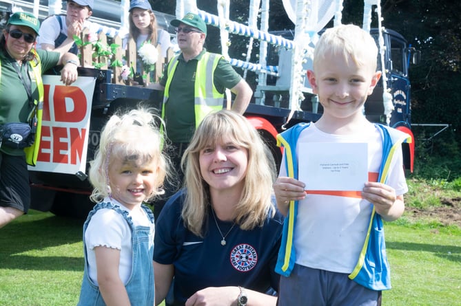 Lottie and Oliver Rhodes were presented with their prize for their Pokemon costumes by Natasha Hamm.