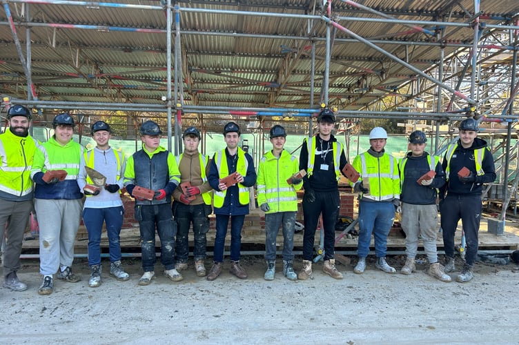 AccXel students with some of the donated bricks.