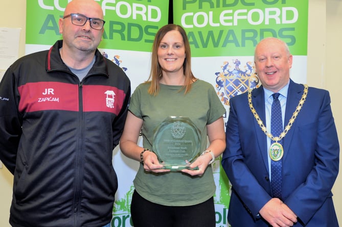 Jason Rooney and Nicola Meek receivng an award on behalf of Broadwell Youth FC.