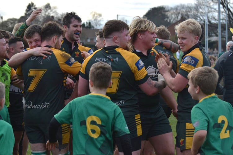 Newent players celebrate after the title-winning victory over Cheltenham. Picture: Georgina Gardner.